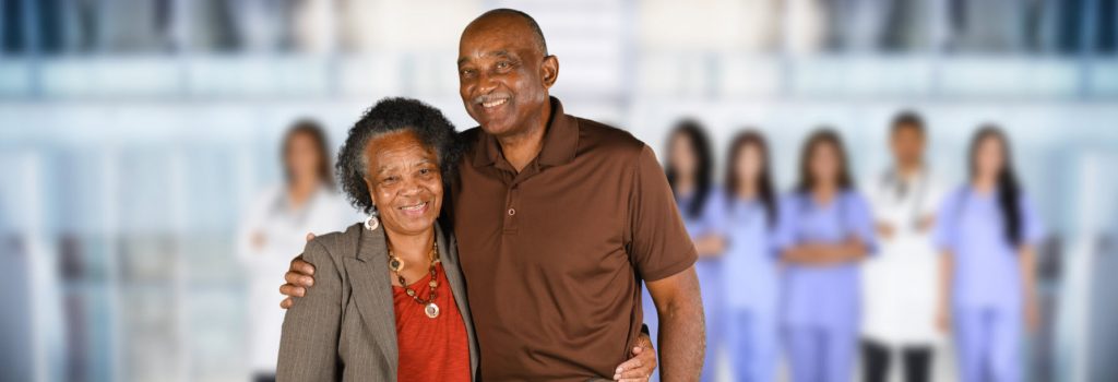 Man and wife with medical team