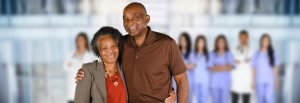 Man and wife with medical team